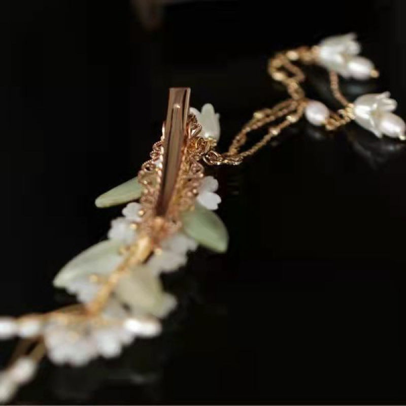 White flowers green leaves orchids tassels hairpins