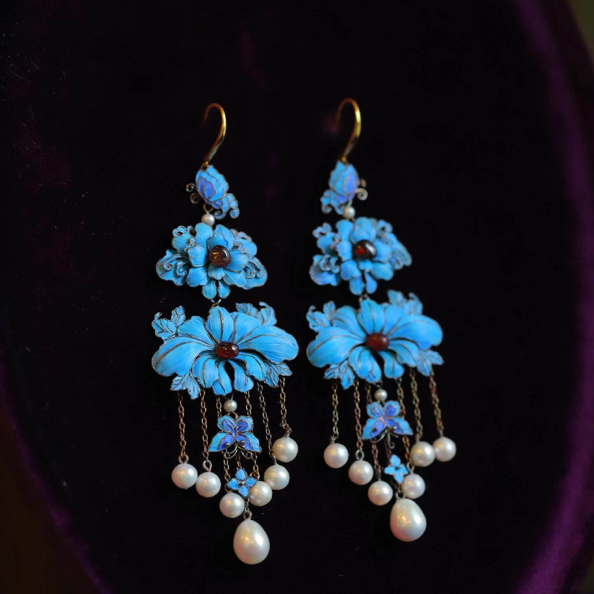 Pair view of the blue peony butterfly earrings with long dangling bead accents