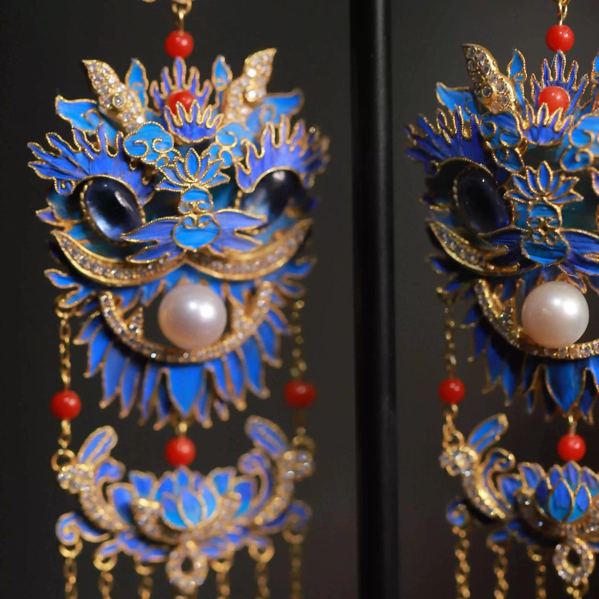 Detailed view of the lion mask and layered tassel design