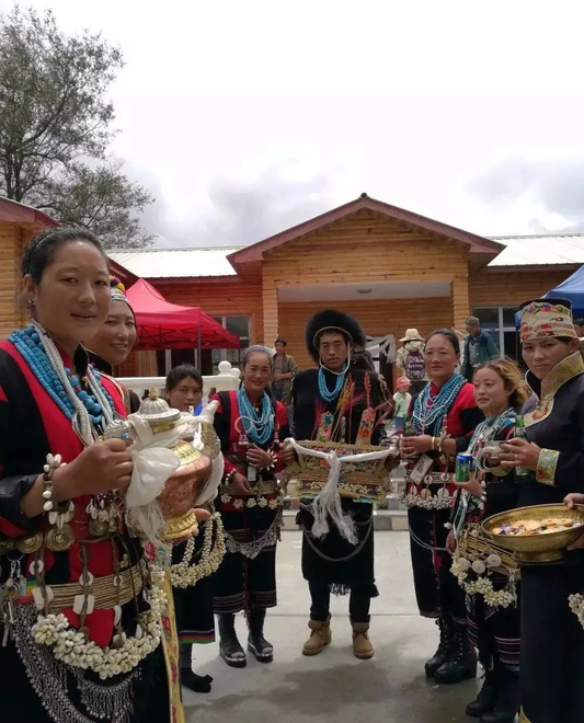 Lhoba community members wearing festival clothing and bead ornaments