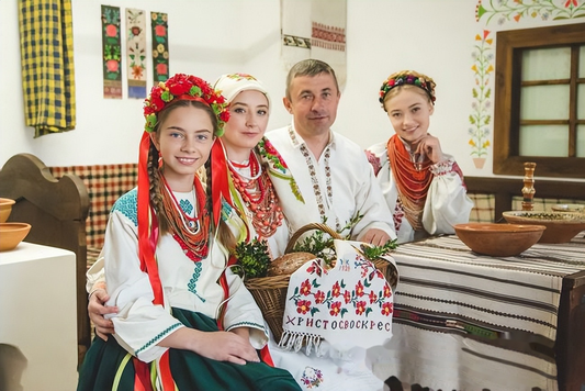 Contemporary Easter-themed cultural scene with embroidered clothing, bread, and a festive cloth