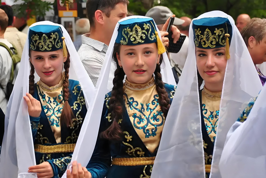 Tatar women wearing embroidered blue-and-gold traditional dress
