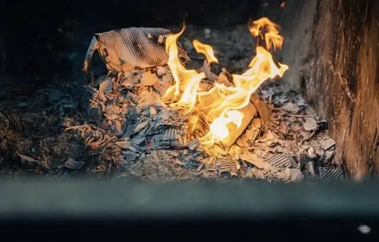 Burning paper offerings during Zhongyuan Festival remembrance