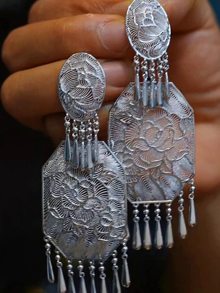 Close-up of the matching pair of peony motif tassel earrings