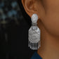 Silver-tone copper peony motif drop earring with dangling tassels shown worn