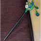 Elegant green and gold hairpin with cloisonné phoenix and stone plum blossom inlay
