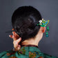 Elegant green and gold hairpin with cloisonné phoenix and stone plum blossom inlay