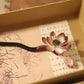 Elegant long hairpin crafted with silk thread, copper wire, and natural sandalwood for traditional bun styling and modern aesthetic fashion