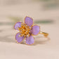 Side detail of the purple floral ring showing its raised flower design