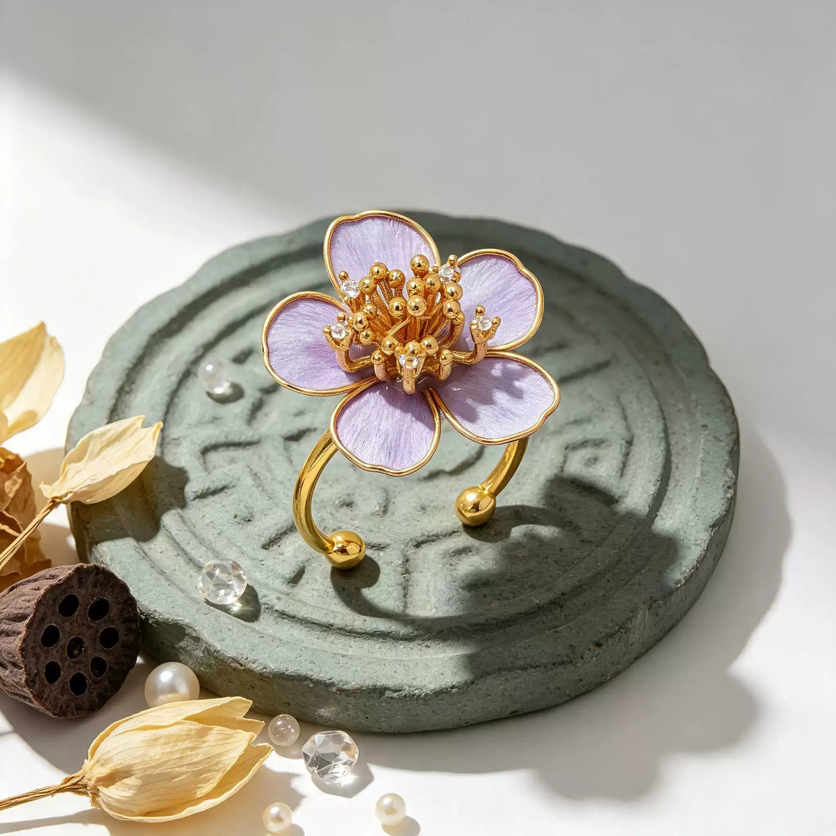 Purple flower adjustable ring shown upright with the open band visible