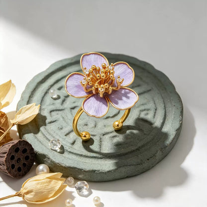 Purple flower adjustable ring shown upright with the open band visible