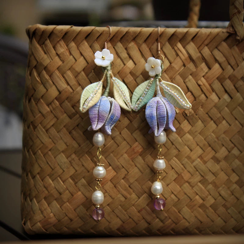 Pair of lavender lily of the valley earrings with silk-wrapped flowers and bead drops