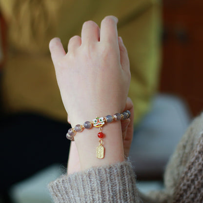 Löwentanz Reichtum Glück Natur Rauch Lila Achat Quasten Armband
