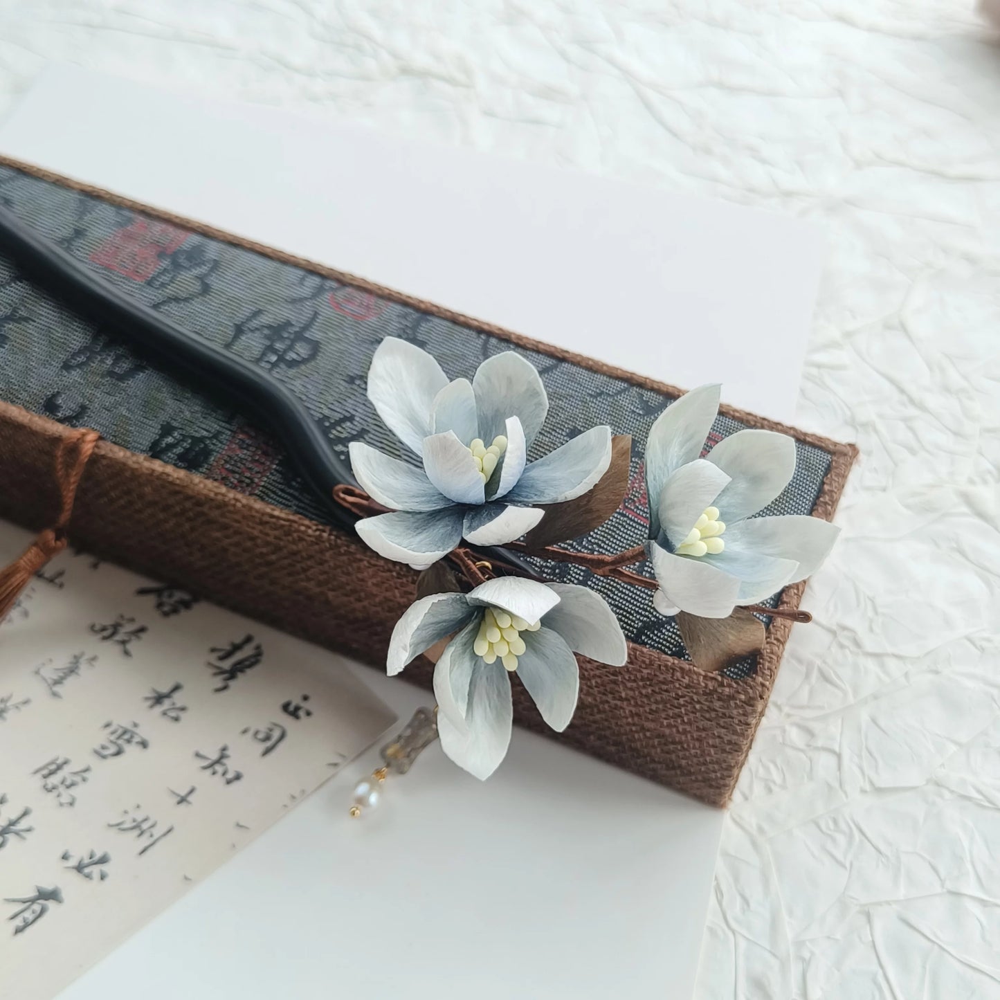 Elegant New Chinese aesthetic hair accessory crafted with mulberry silk and natural sandalwood for timeless cultural beauty