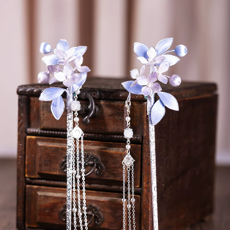 Pair of matching purple floral hairpins with long tassels