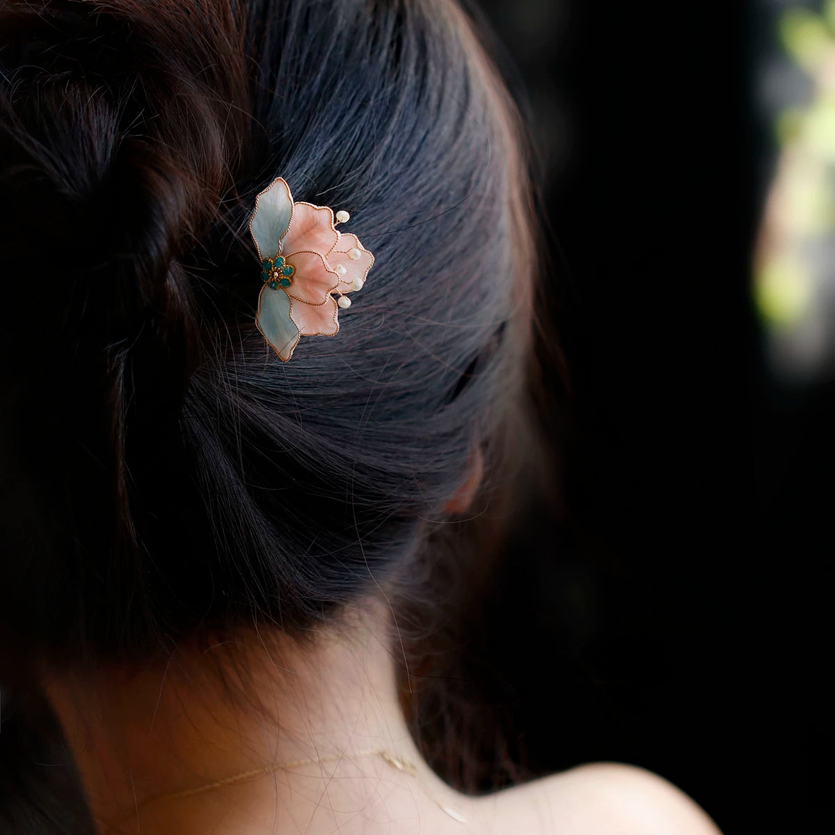 Velvet flower wooden hairpin styled in dark hair