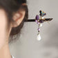 Side view of the purple butterfly hair stick with dangling beads