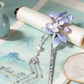Single purple floral tassel hairpin intended for the right side