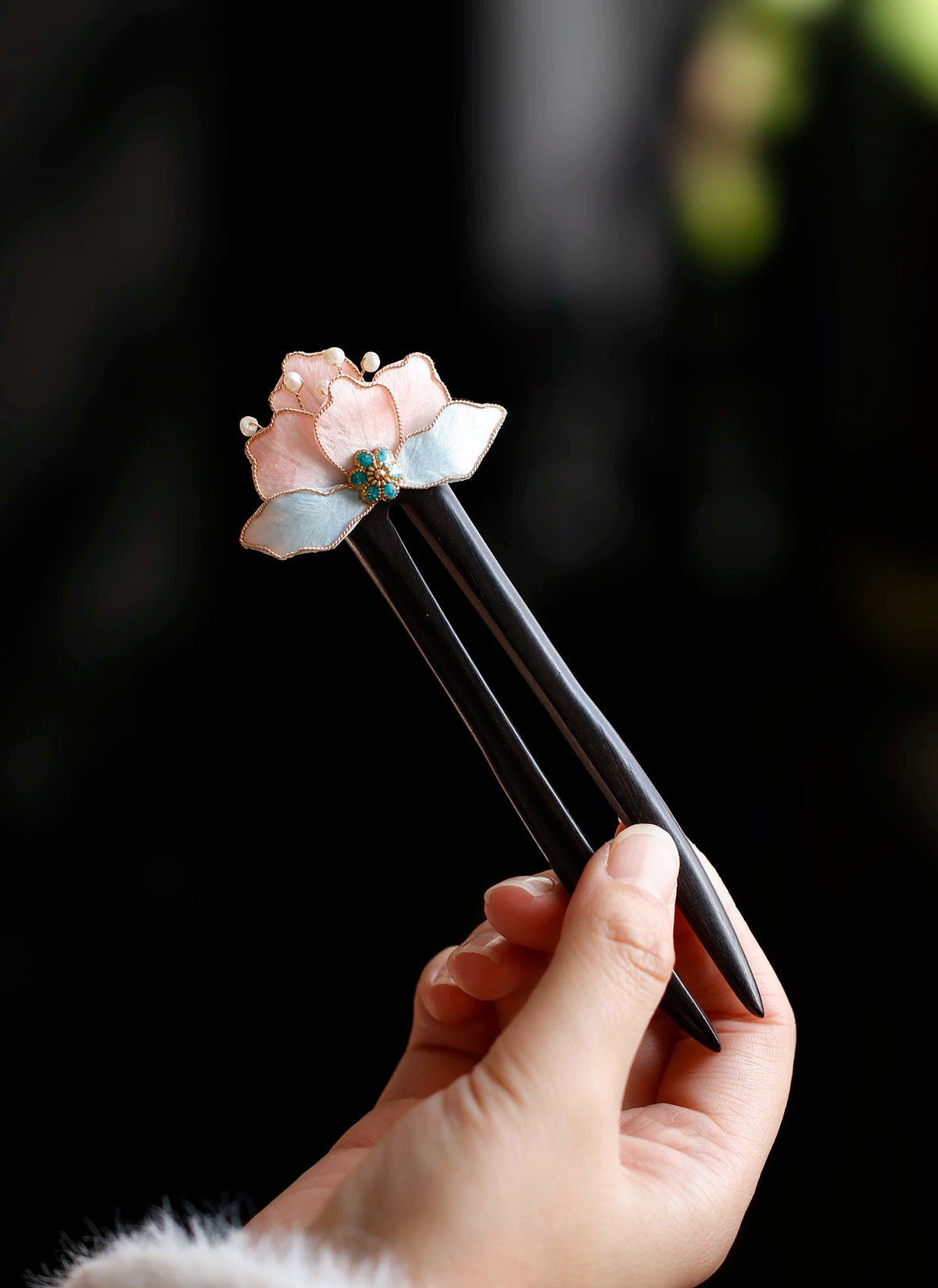 Handmade flower wooden hairpin on black background