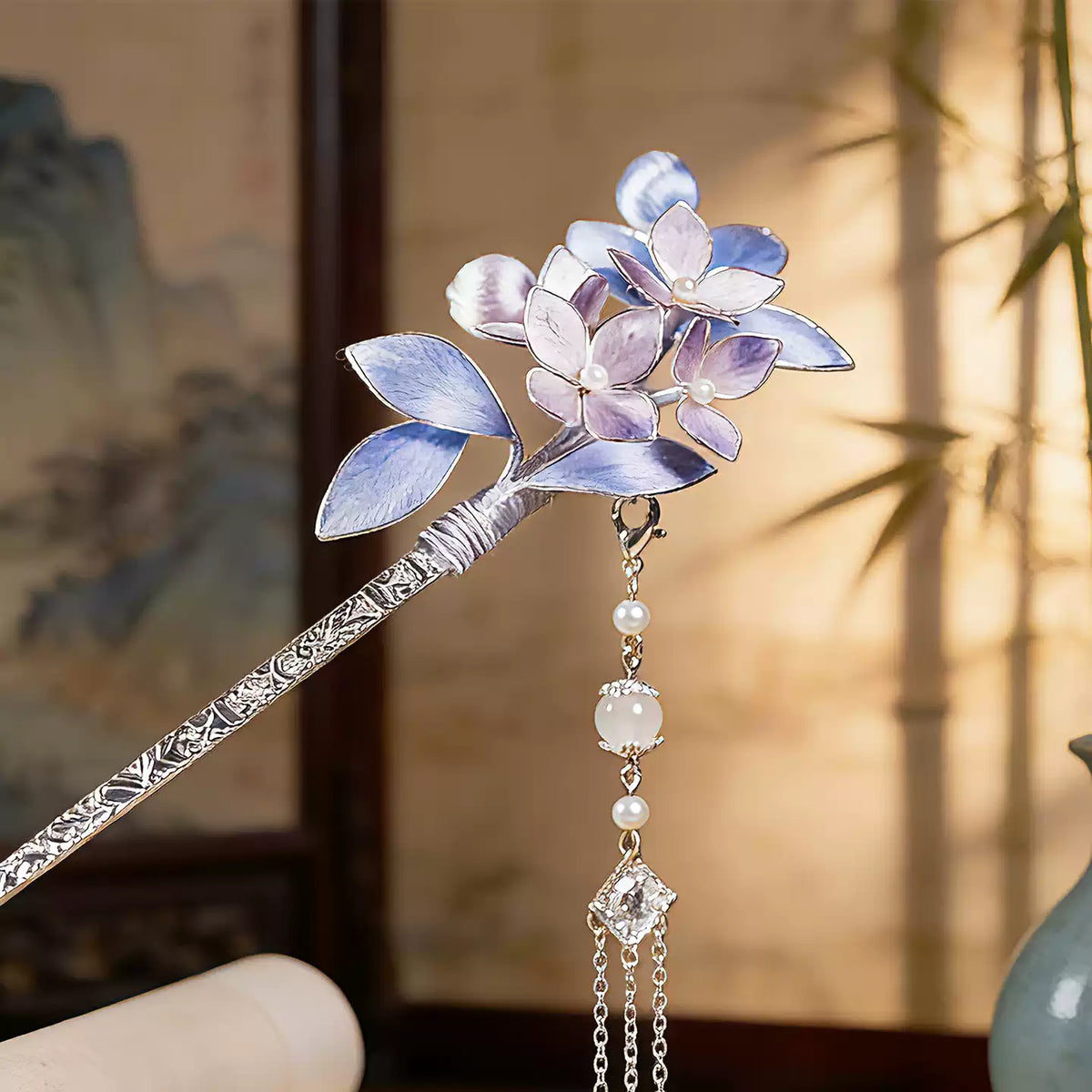 Purple floral tassel hair accessory displayed against a neutral background