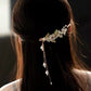 White flowers green leaves orchids tassels hairpins