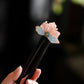 Handmade pink and blue velvet flower wooden hairpin close-up