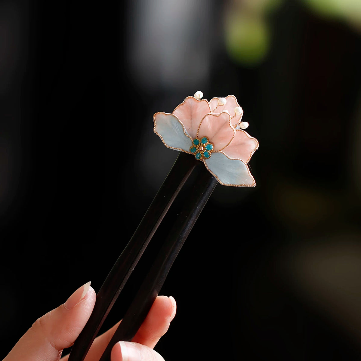 Handmade pink and blue velvet flower wooden hairpin close-up