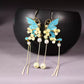 Pair of blue butterfly and flower tassel earrings
