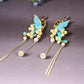 Blue butterfly floral statement earrings, product view