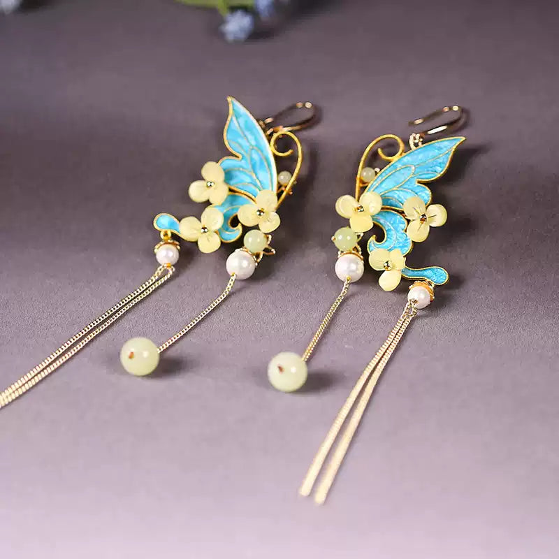 Blue butterfly floral statement earrings, product view