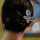 Close view of the blue butterfly hairpin in an updo