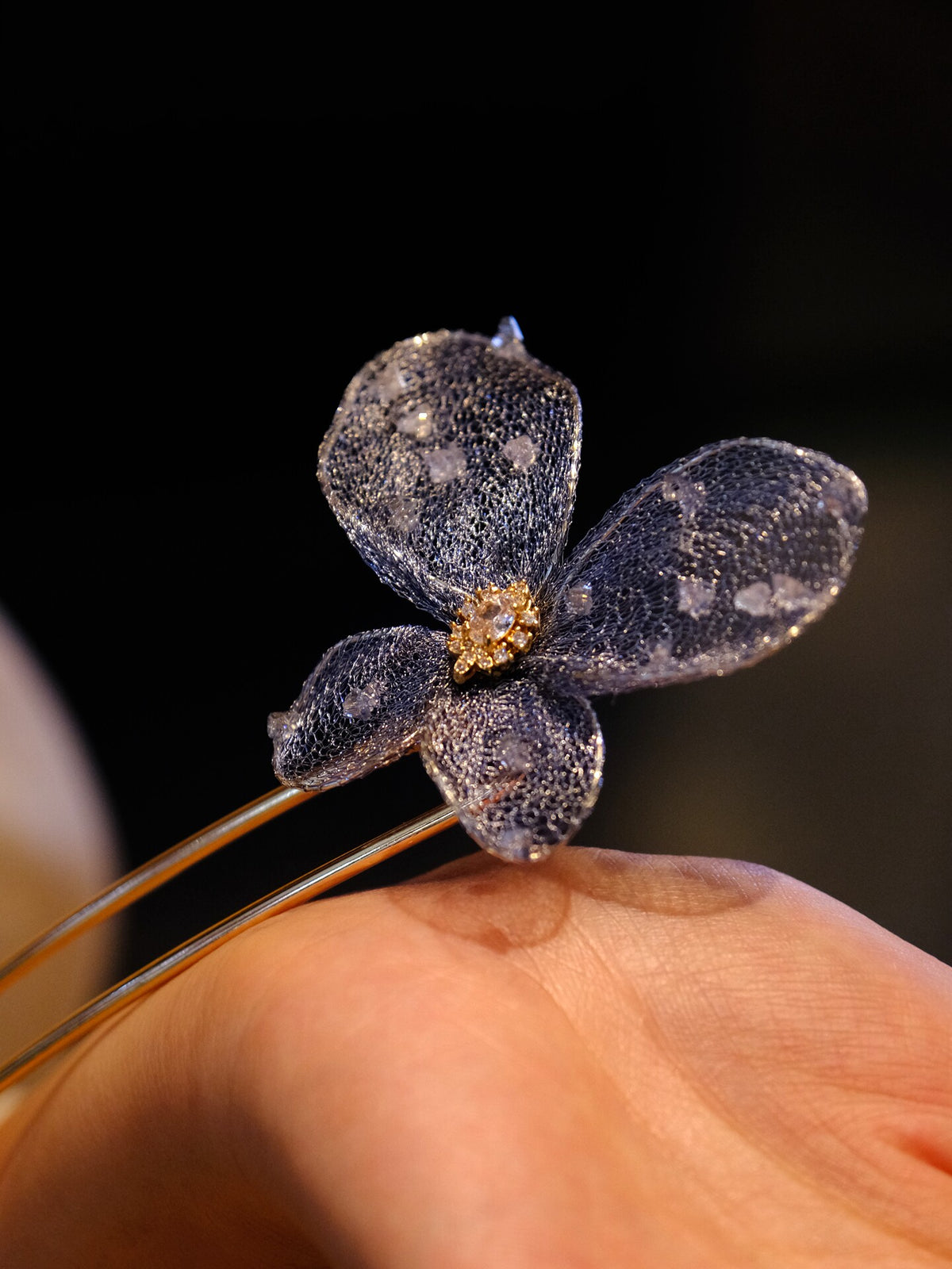 Blue butterfly hairpin worn in a low bun