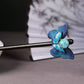 Close-up of the blue butterfly ornament on the wooden hair stick