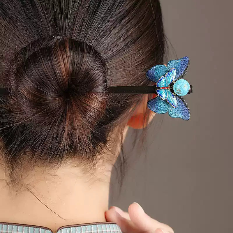 Side view of the butterfly hairpin worn in an updo