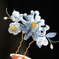 Blue chrysanthemum floral hair stick shown in detail