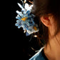 Close view of the blue chrysanthemum hairpin in an updo