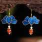 Close view of the blue petal design with gold-tone edging and bead drops