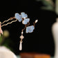Close-up of blue fabric ginkgo leaf U hairpin with faux pearl and dangling tassel