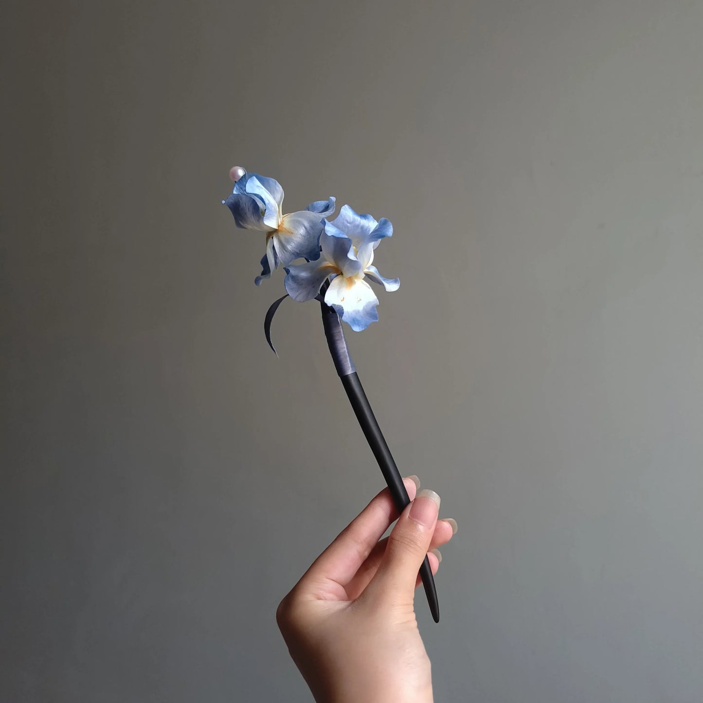 Front view of handmade blue iris Ronghua hairpin