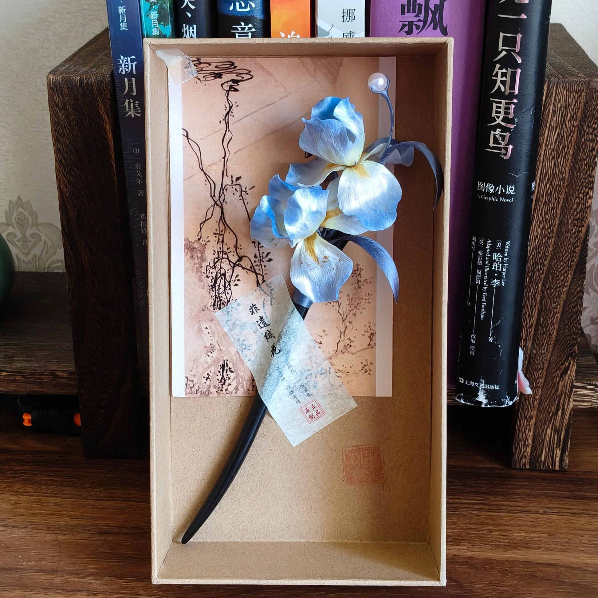 Blue iris Ronghua hairpin displayed in its presentation box