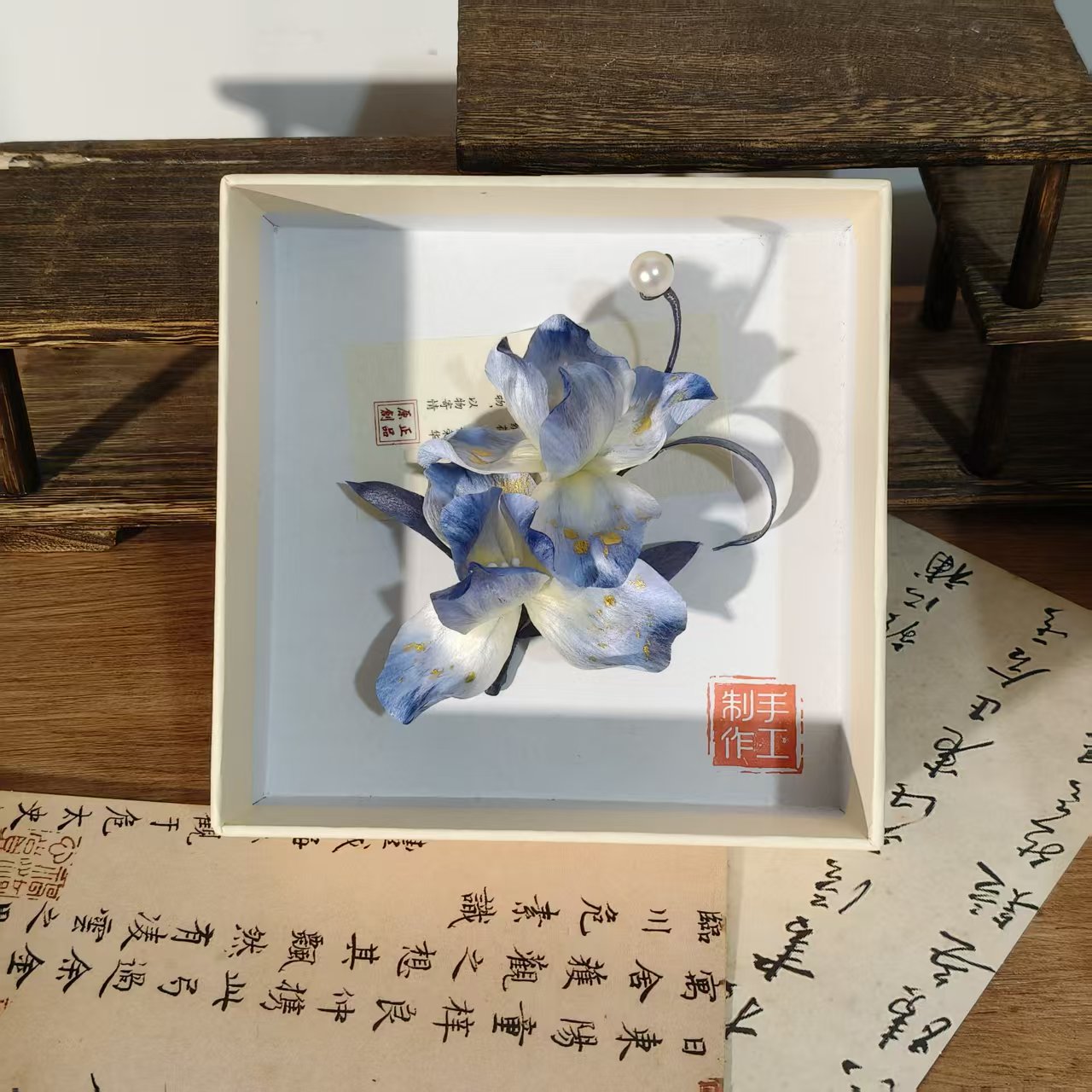 Full view of boxed blue iris Ronghua hairpin