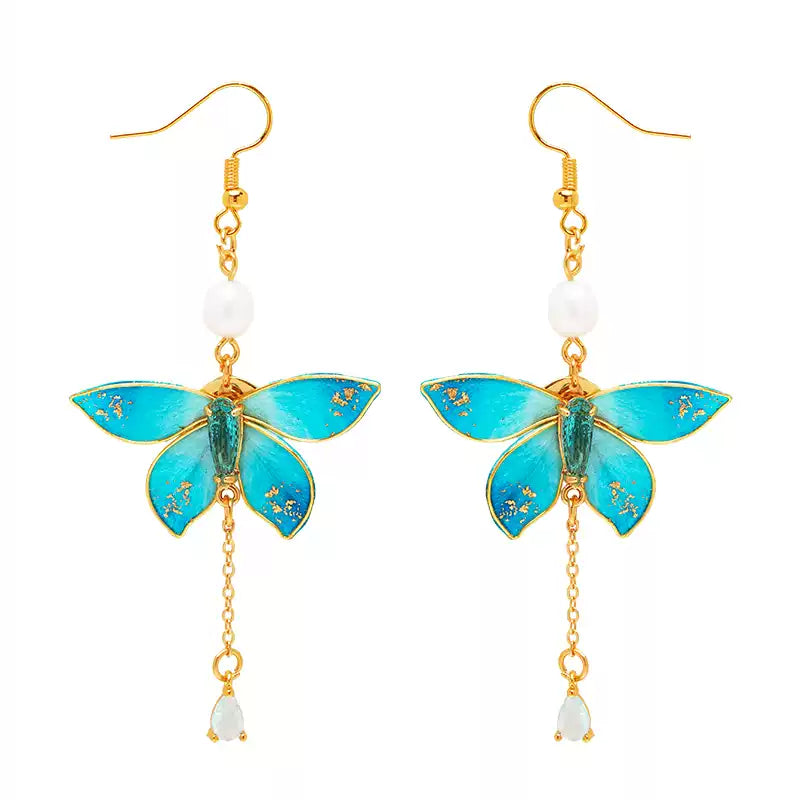 Pair of blue butterfly drop earrings with freshwater pearl accents and ear hooks