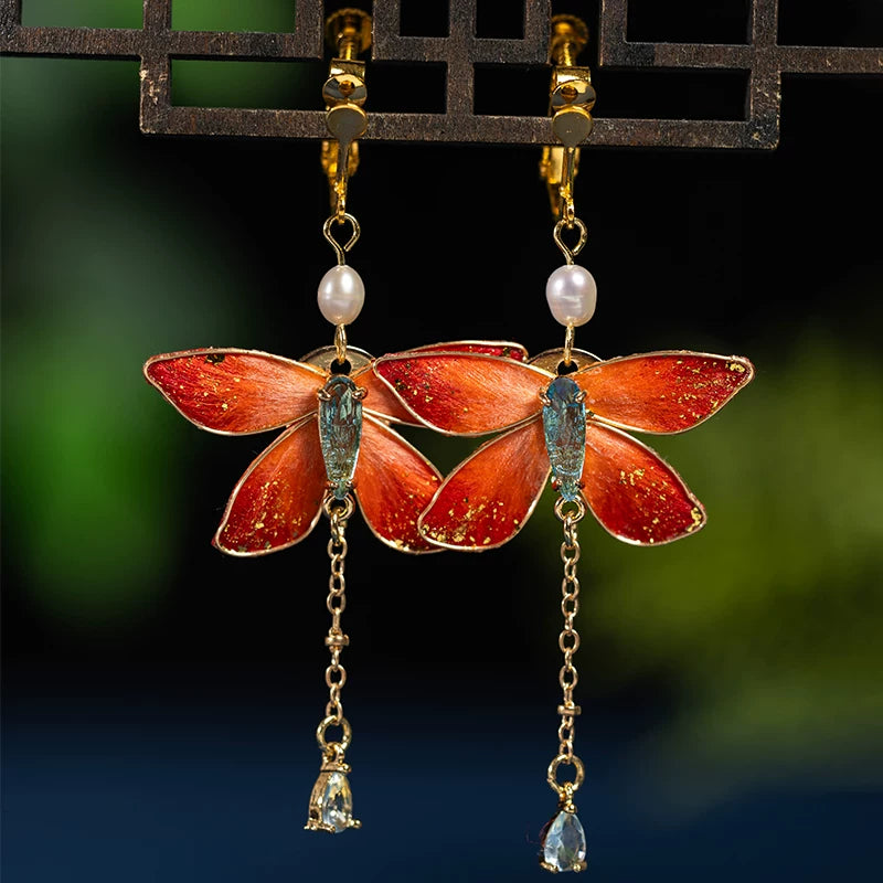 Pair of red butterfly drop earrings with clip-on fastenings