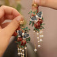 Close view of colorful butterfly and bead tassel details