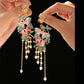 Qingyi Ballad color butterfly tassel earrings on dark display