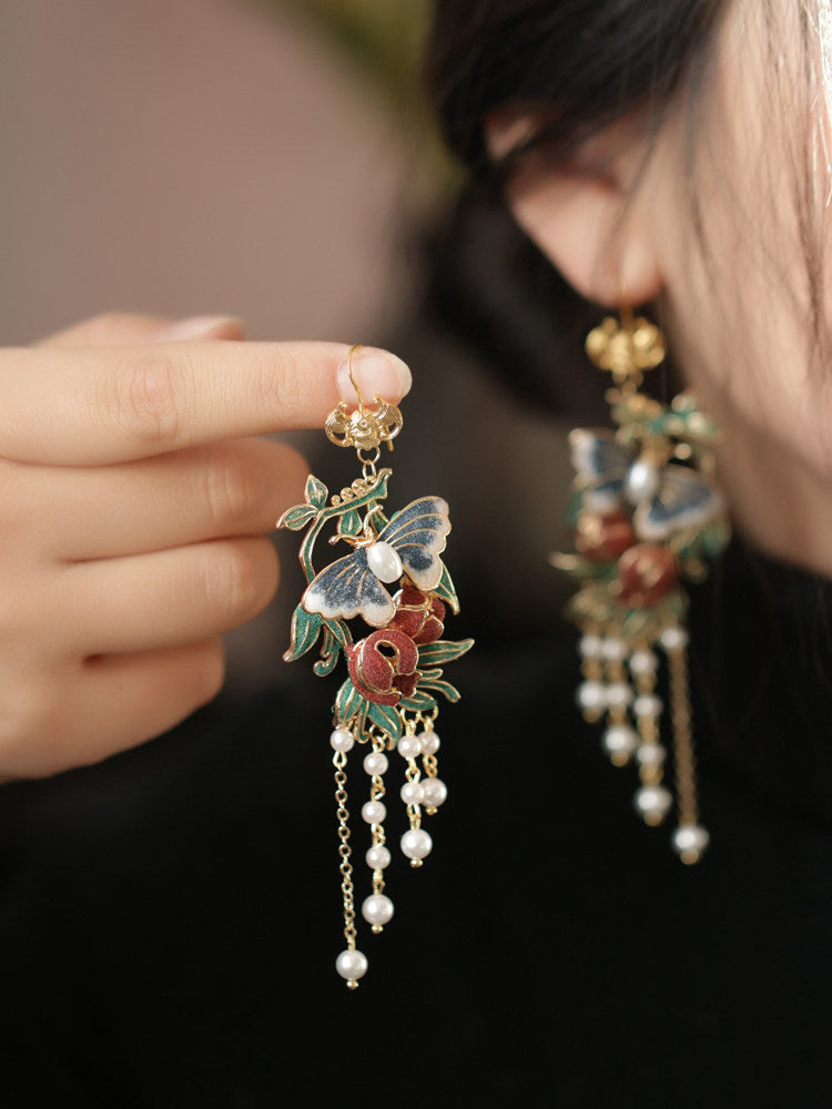 Colorful butterfly tassel earrings shown worn