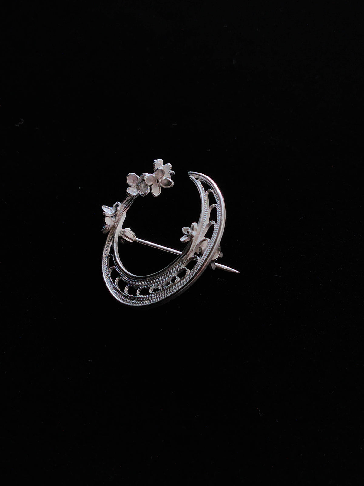 Reverse view showing the pin clasp on the crescent moon brooch
