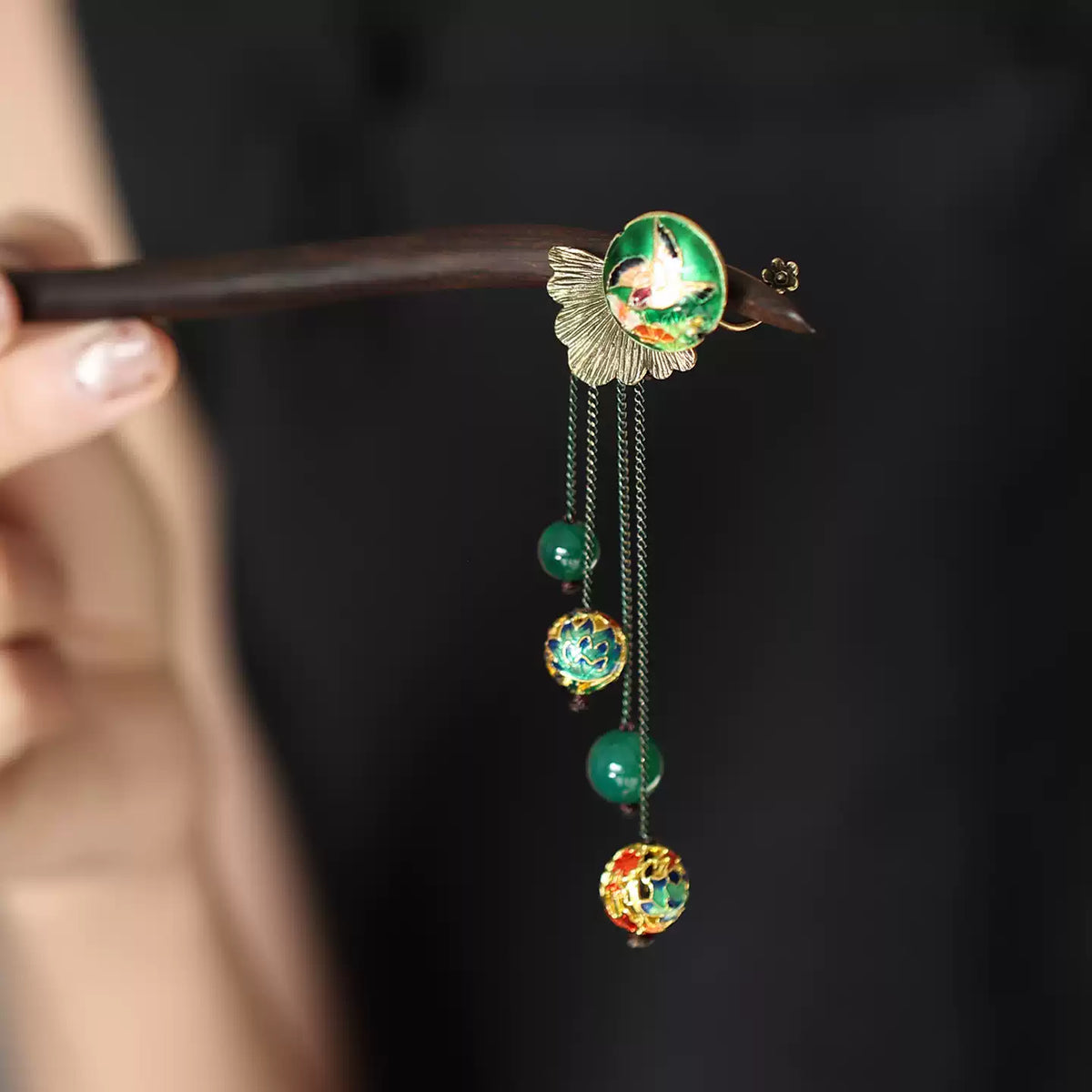 Detail view of the medallion and hanging bead tassels