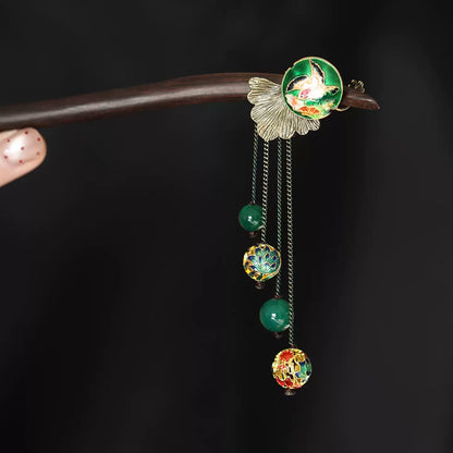 Dark wood hair stick with green bird medallion and dangling bead tassels