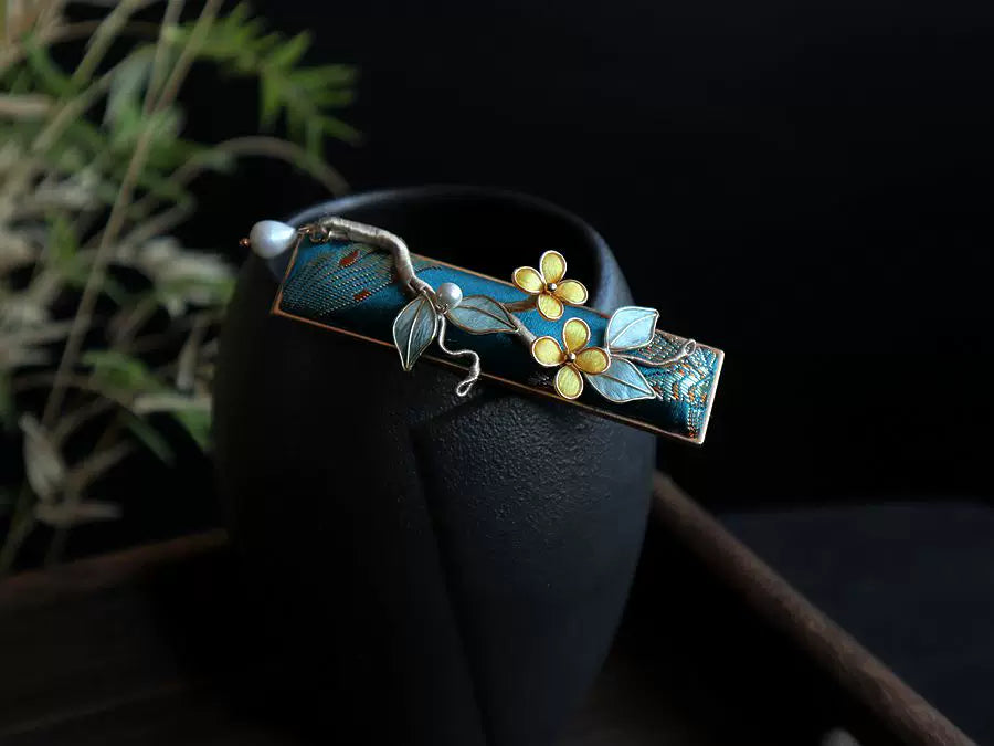 Deep blue brocade hair clip displayed against a dark background